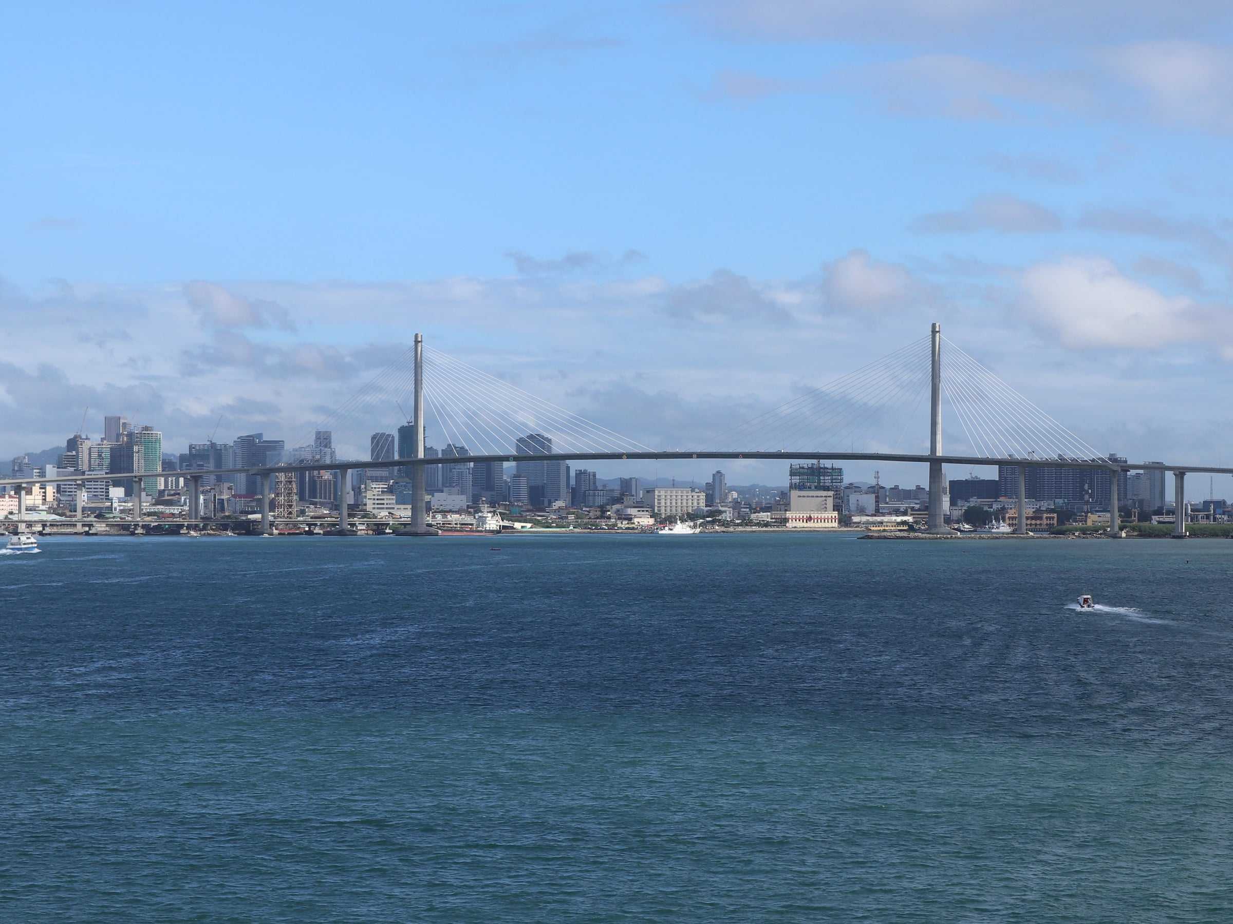 Cebu City skyline and the cable-stayed CCLEX bridge seen across the Cebu Strait