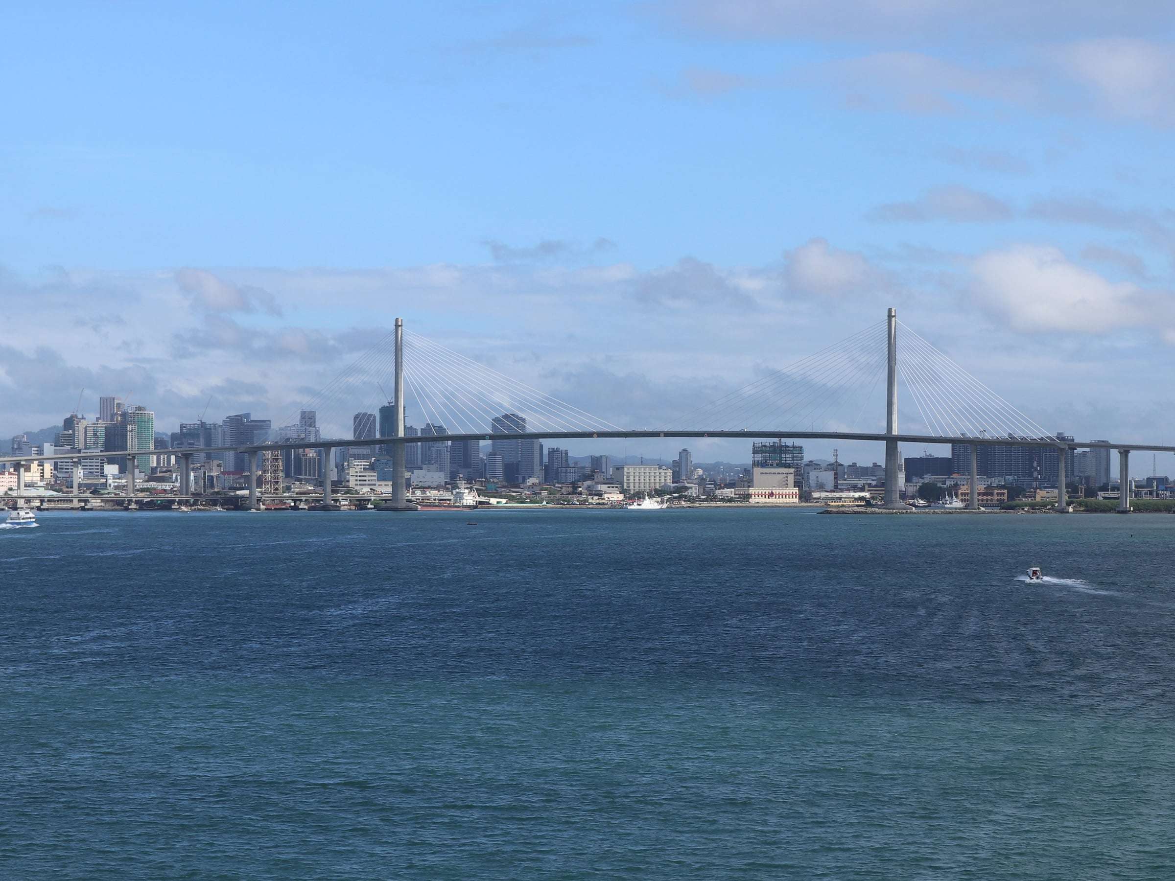 Cebu City skyline and the cable-stayed CCLEX bridge seen across the Cebu Strait